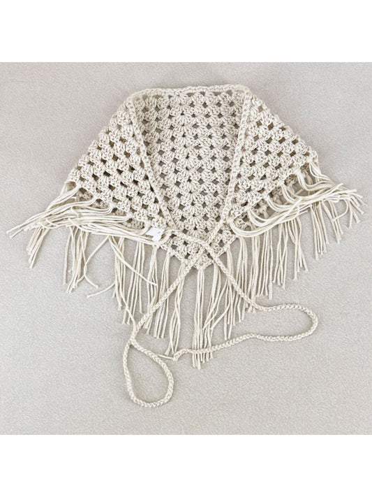 Close-up of intricate crochet pattern and tassel details on the bandana