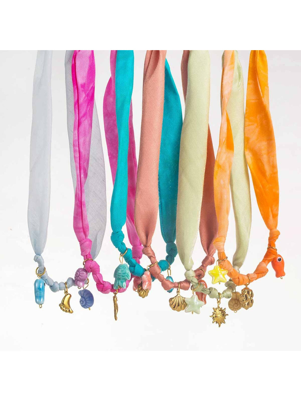 Close-up of Neckit Summer Charm fabric necklace with colorful beads and charms