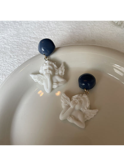 Close-up of Earwish Angel Charm Drop Earrings showing detailed angel charm
