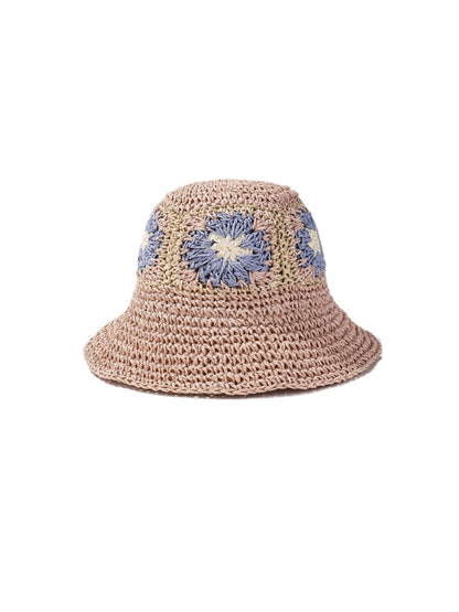 Model wearing Haila crochet flower patch bucket hat outdoors