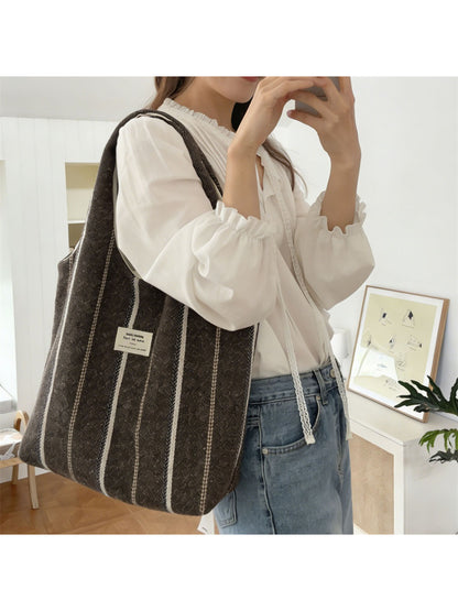 Cosbai vintage stripe slouchy tote bag displayed hanging with visible slouchy shape and striped pattern