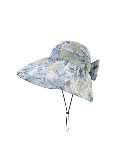 Close-up of Haila garden print shade hat fabric with green and pink floral design