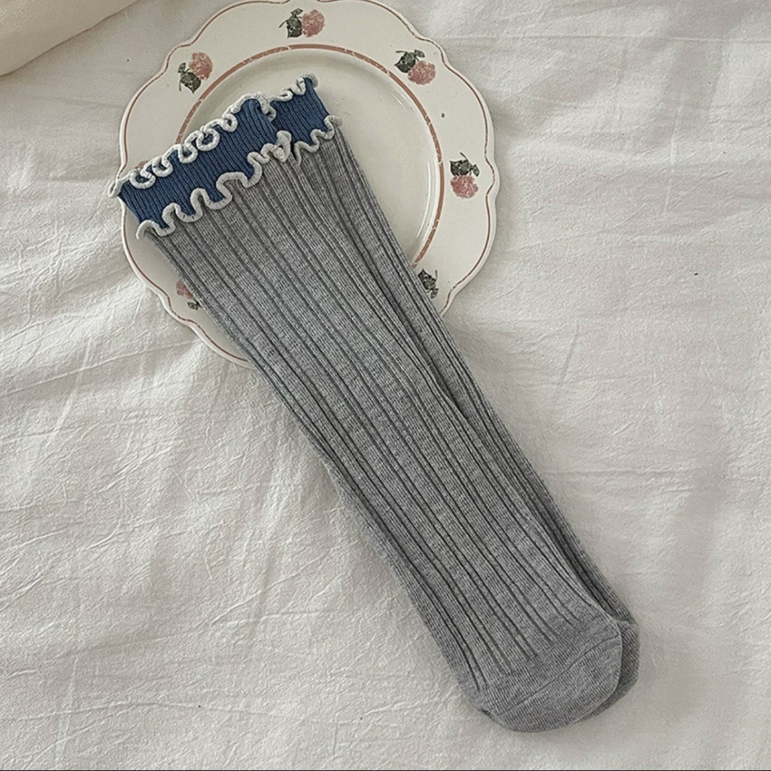 Rufia socks folded to display contrast wave trim design