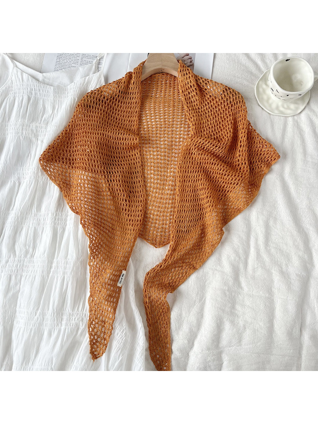 Crochet triangle shawl scarf displayed flat with visible triangular shape