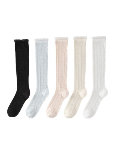 Model wearing Rufia soft cable knee high socks with casual outfit