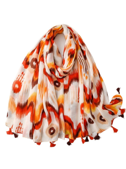Scarvii Boho Ikat Tassel Wrap folded showing blue and white ikat pattern with tassels