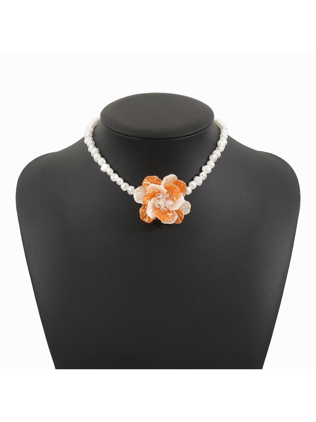 Side view of white beaded flower necklace highlighting bead texture and clasp