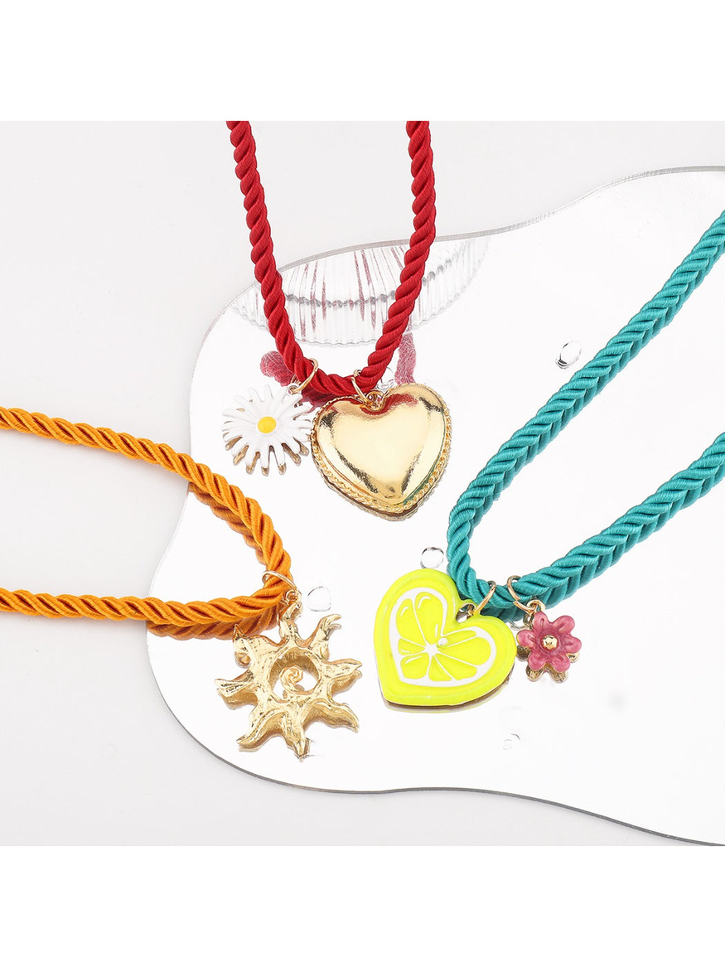 Neckit colourful charm rope necklace styled with layered bracelets on wrist