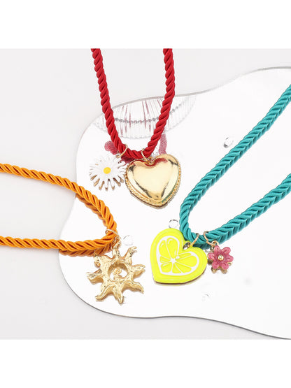 Neckit colourful charm rope necklace styled with layered bracelets on wrist