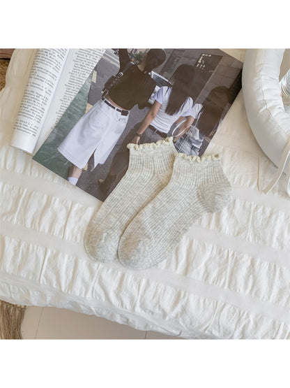 Close-up of fabric texture and bobble trim on Rufia soft ankle socks