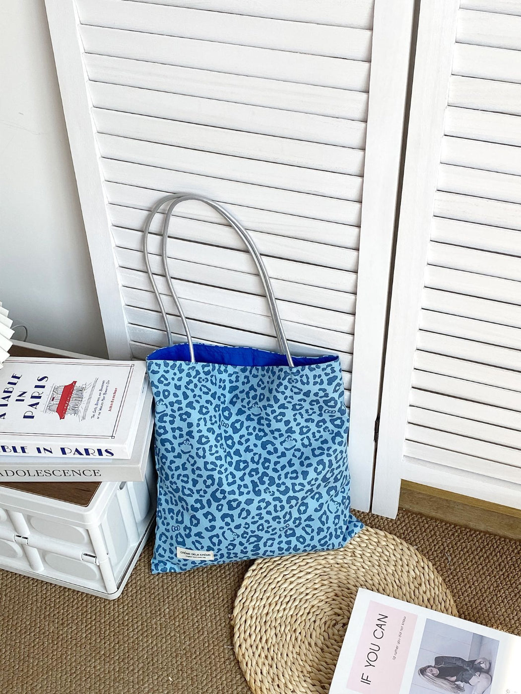 Cosbai leopard print tote bag held by model wearing casual outfit