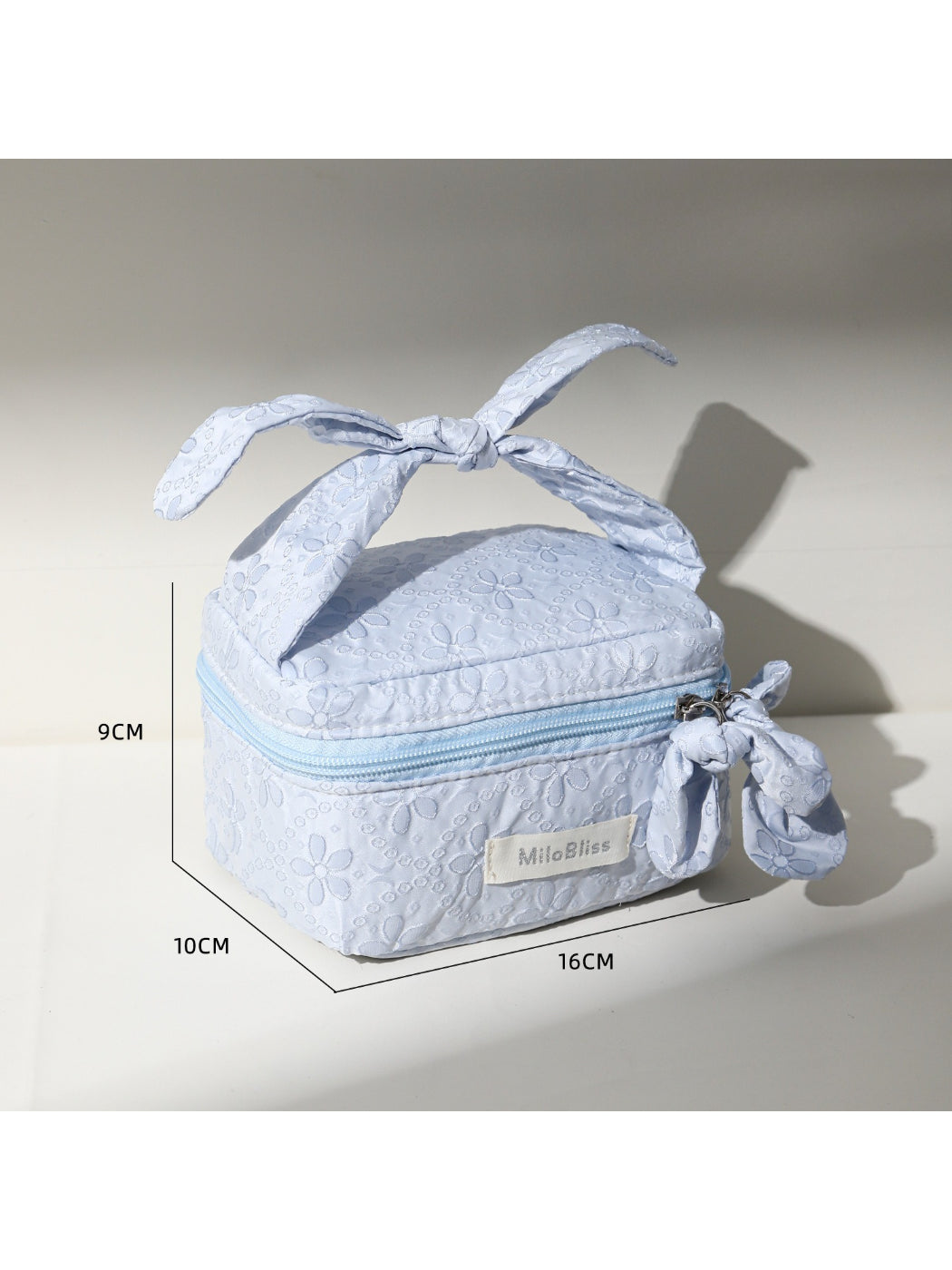 Cosbai Bow Top Handle Makeup Case placed on a flat surface with bow detail visible
