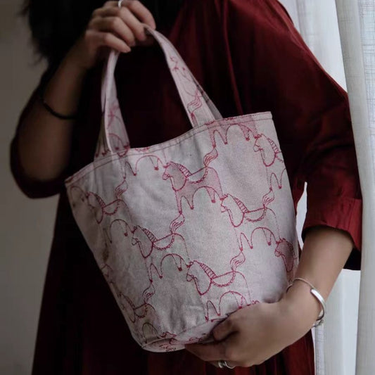 Cosbai tote bag featuring a sketch horse print on a light background