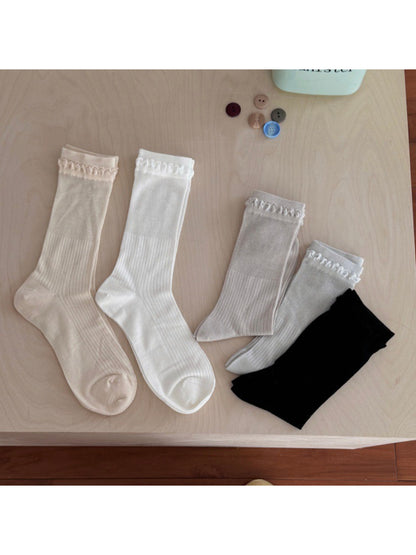 Rufia crew socks displayed flat showing ribbed pattern and loop trim