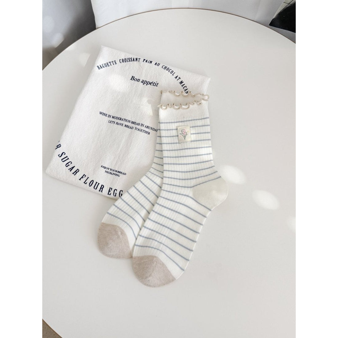 Side view of Rufia Lettuce Edge Stripe Crew Socks highlighting stripe pattern