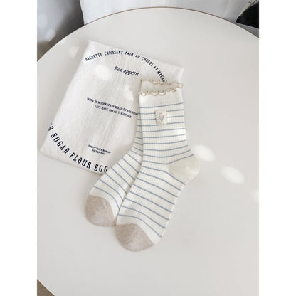 Side view of Rufia Lettuce Edge Stripe Crew Socks highlighting stripe pattern