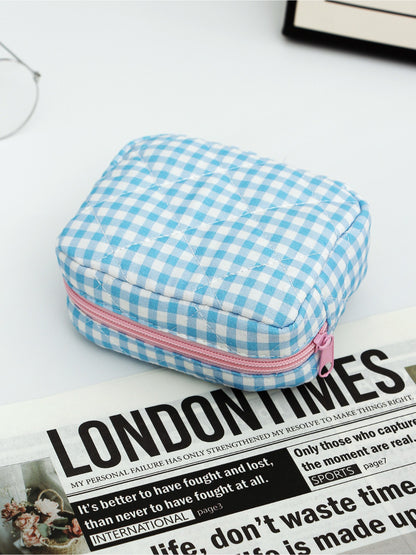 Close-up of Cosbai checkered makeup pouch duo featuring ruffle trim detail