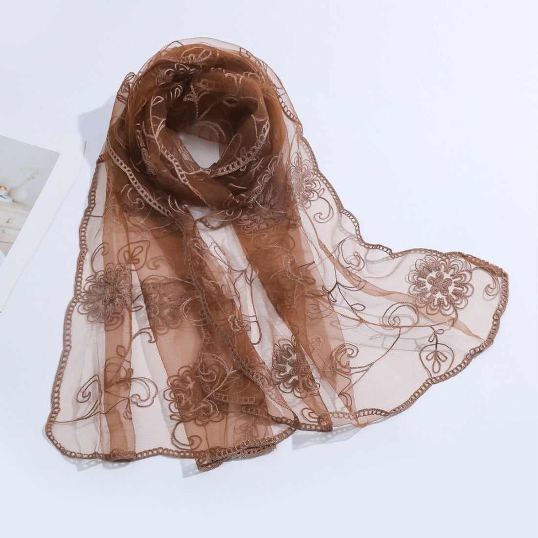 Scarvii scarf showing transparent floral mesh fabric texture