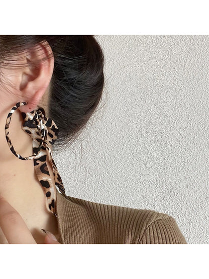 Side view of Leopard Ribbon Hoop Earrings showing the hoop shape and fabric ribbon pattern