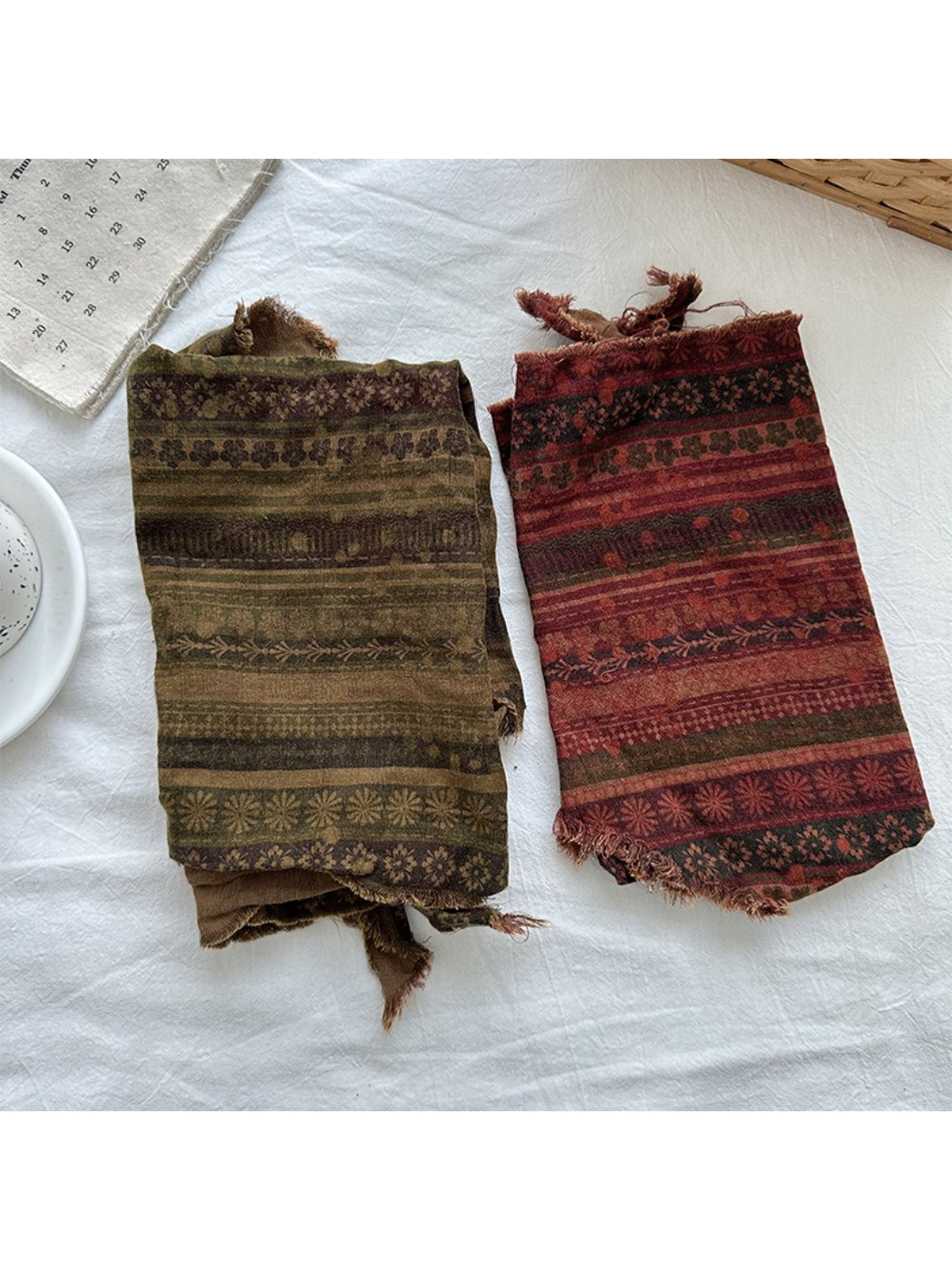 Scarvii triangle scarf folded to highlight frayed trim and vintage wash finish