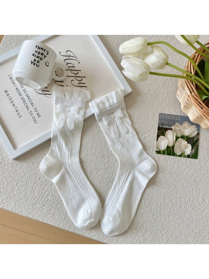 Side view of Rufia crew socks showing ribbon trim detail