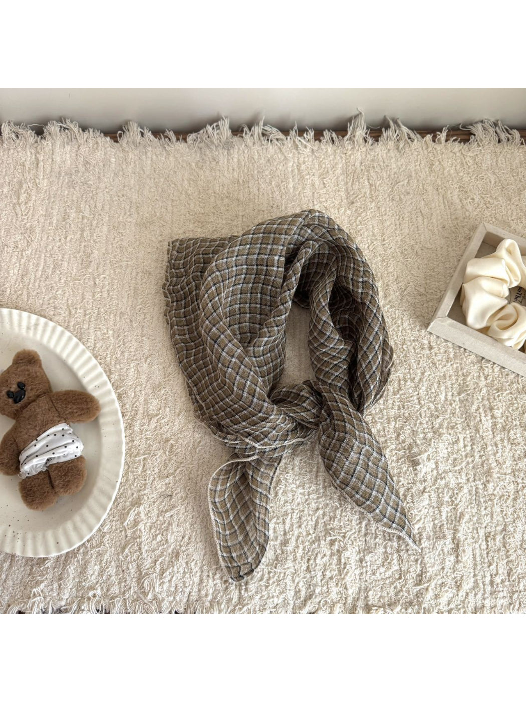 Soft check bandana scarf styled as a face covering on model
