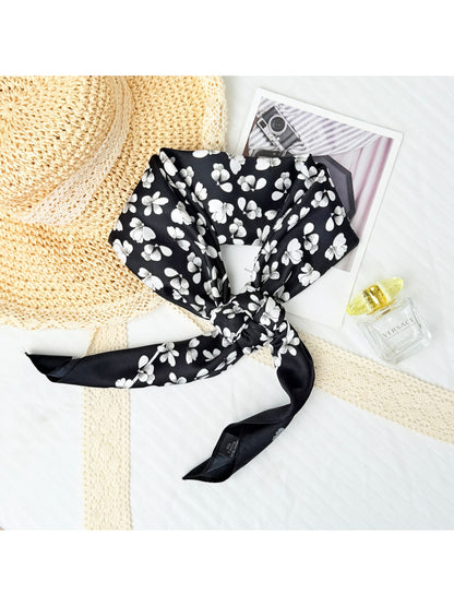 Small square scarf styled as a headband with floral design and light colors