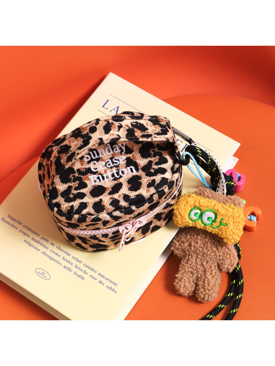 Side view of Cosbai leopard round makeup organizer bag showing shape and pattern