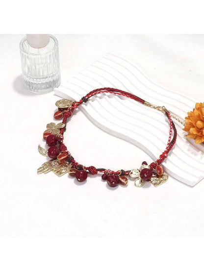 Side view of Neckit beaded necklace with multiple floral charms