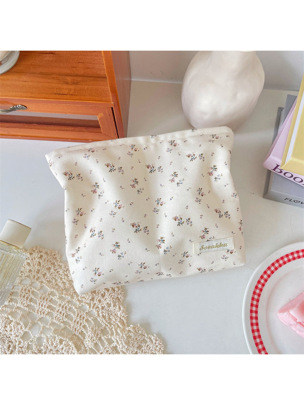 Cosbai cosmetic pouch standing upright showing full floral design and