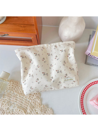 Cosbai cosmetic pouch standing upright showing full floral design and