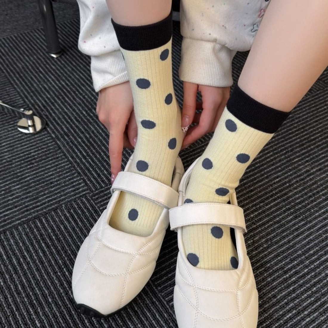Close-up of Rufia mid-calf socks highlighting dot color block contrast pattern