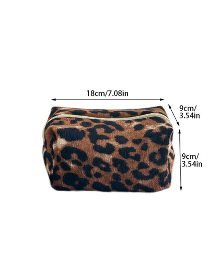 Cosbai leopard print makeup bag packed inside a suitcase for travel