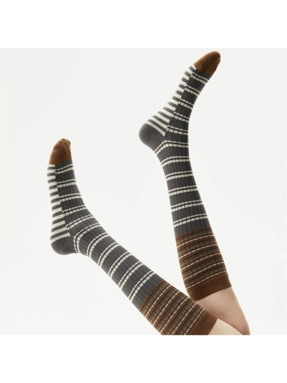 Close-up of Rufia crew socks showing layered fabric and stripe details