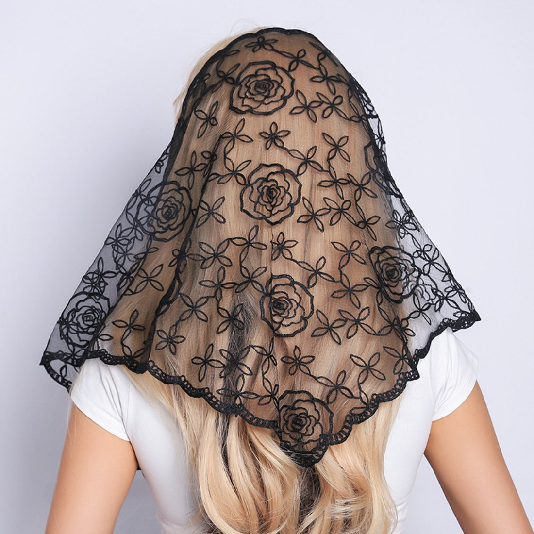 Haila Rose Vine Lace Veil Scarf draped over a mannequin head in soft pink