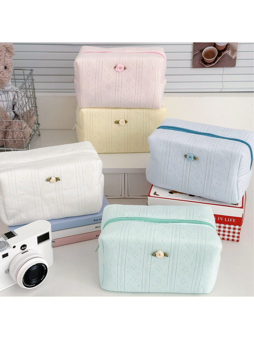 Cosbai soft textured cosmetic pouch in beige with rose detail on front