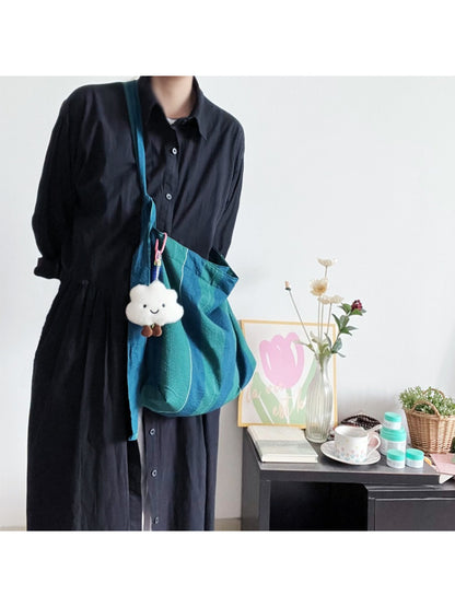 Side view of Cosbai Wide Stripe Slouch Tote Bag showing spacious interior and soft fabric