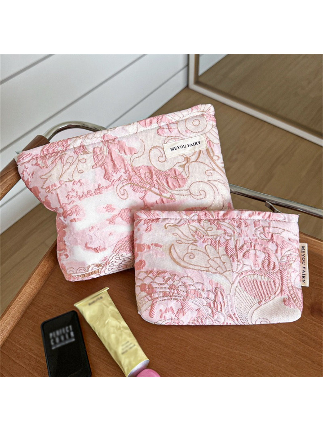 Cosbai pink floral cosmetic bag with vibrant flower pattern on a light background