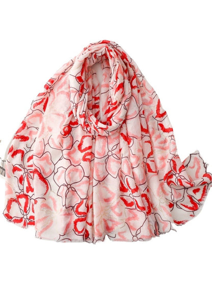 Pink Petal Statement Scarf folded showing floral pattern and soft fabric texture