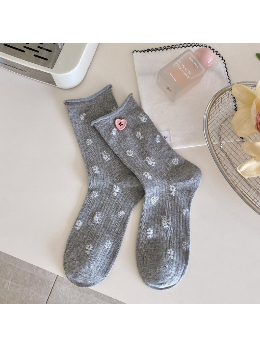 Rufia socks paired with rolled-up jeans to showcase the crew height
