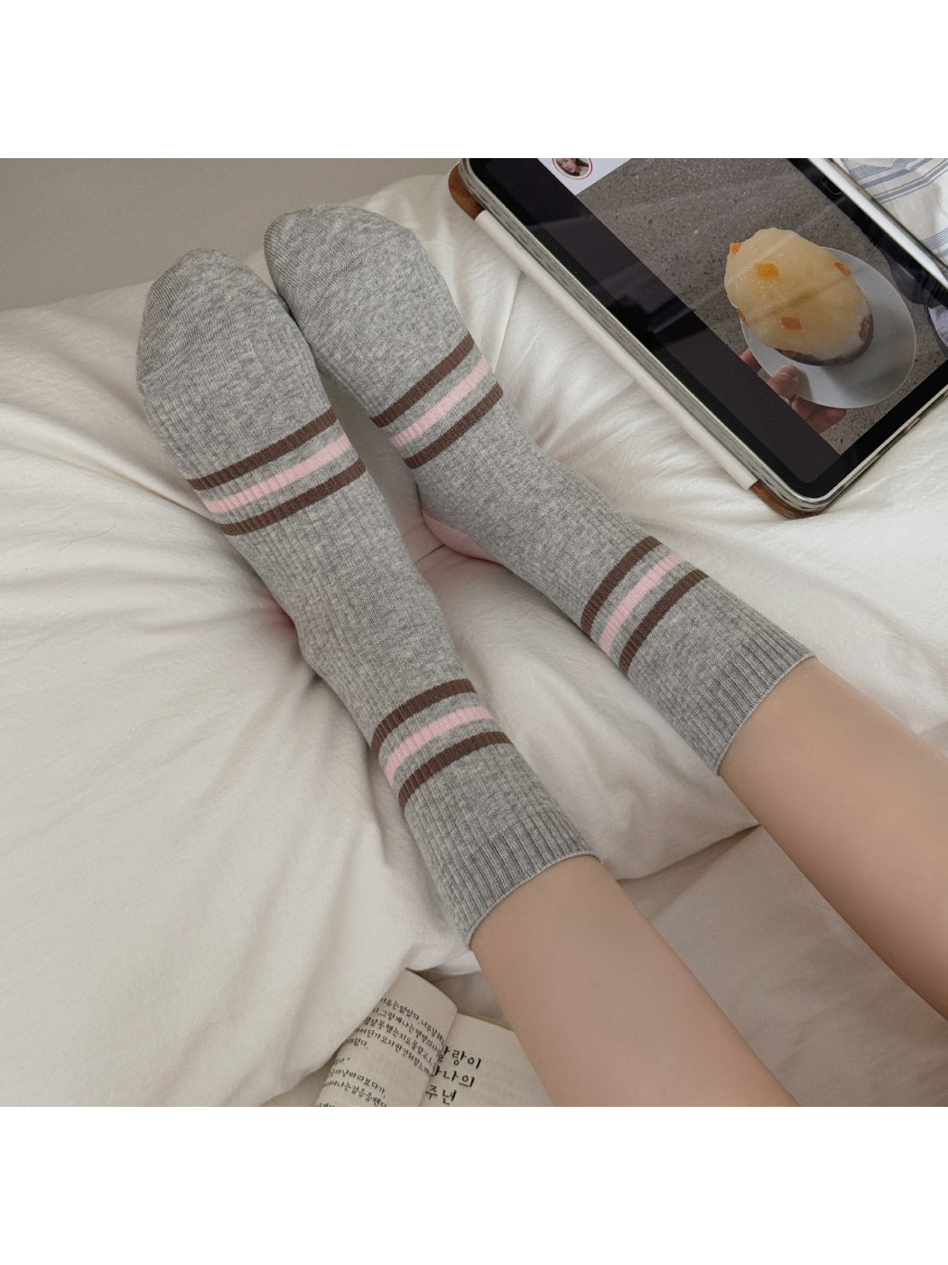Close-up of Rufia ribbed socks showing texture and colour block design in soft hues