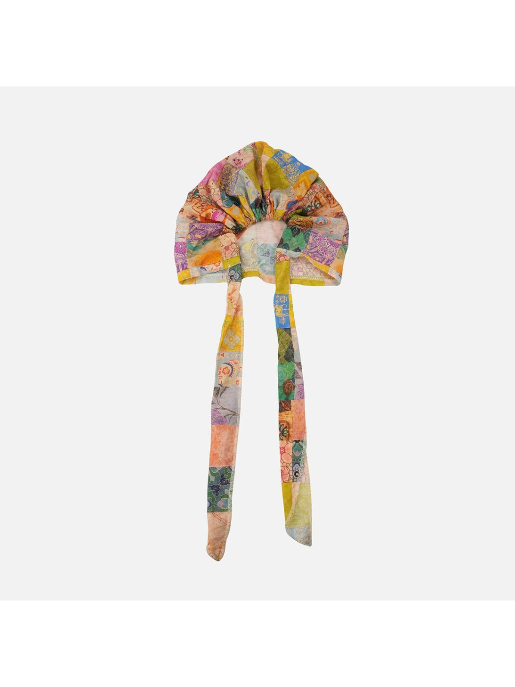 Scarvii sheer retro print headscarf tied as a hair accessory on model