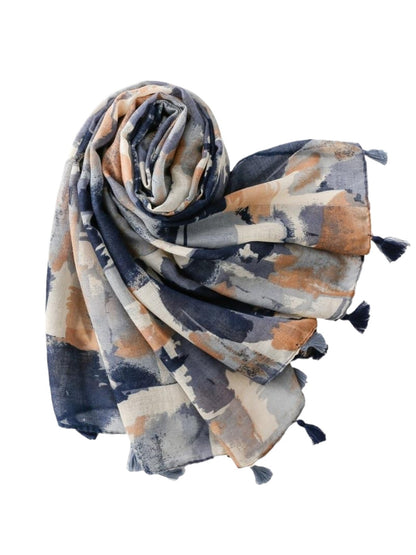 Model wearing Scarvii abstract brushstroke scarf styled around the neck