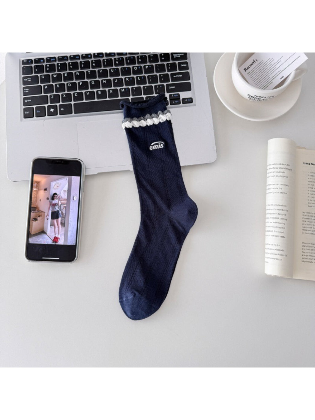 Model wearing Rufia contrast braid knit socks with casual shoes and rolled-up pants