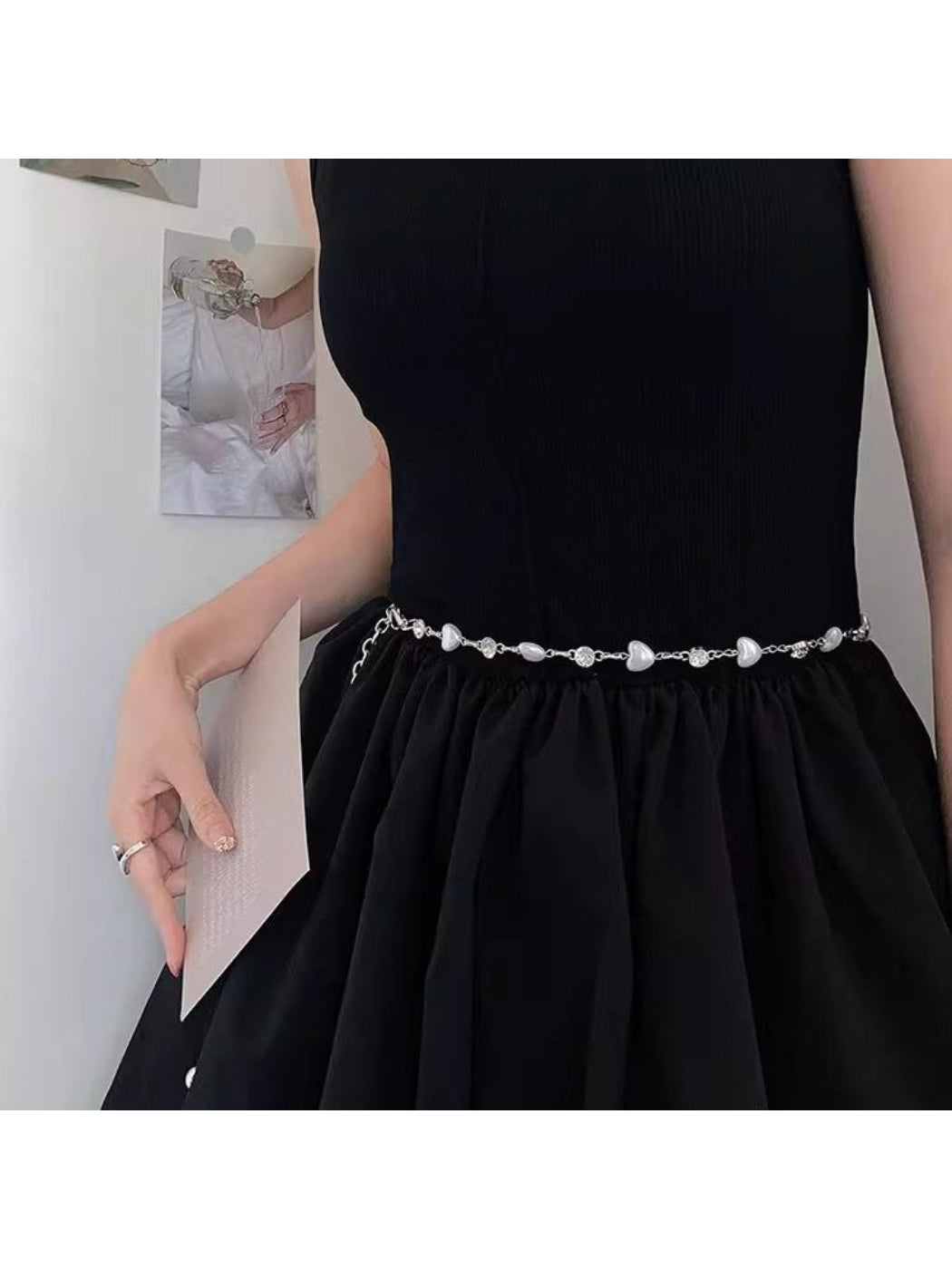 Model wearing Beco delicate heart chain waist belt over a dress