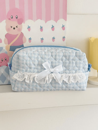 Side view of Cosbai lace bow gingham cosmetic pouch highlighting fabric texture