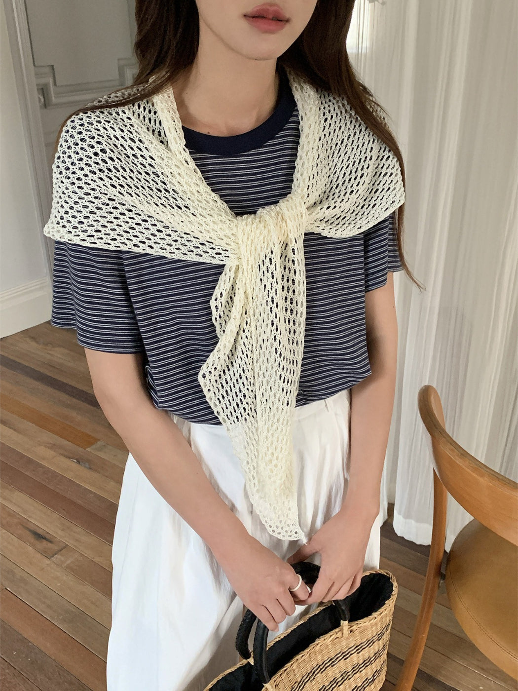 Full view of crochet triangle shawl scarf laid out showing shape and design
