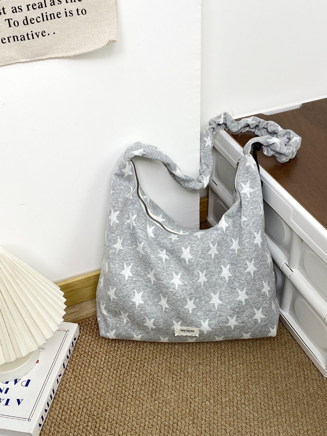 Close-up of star print pattern on Cosbai slouchy shoulder bag fabric