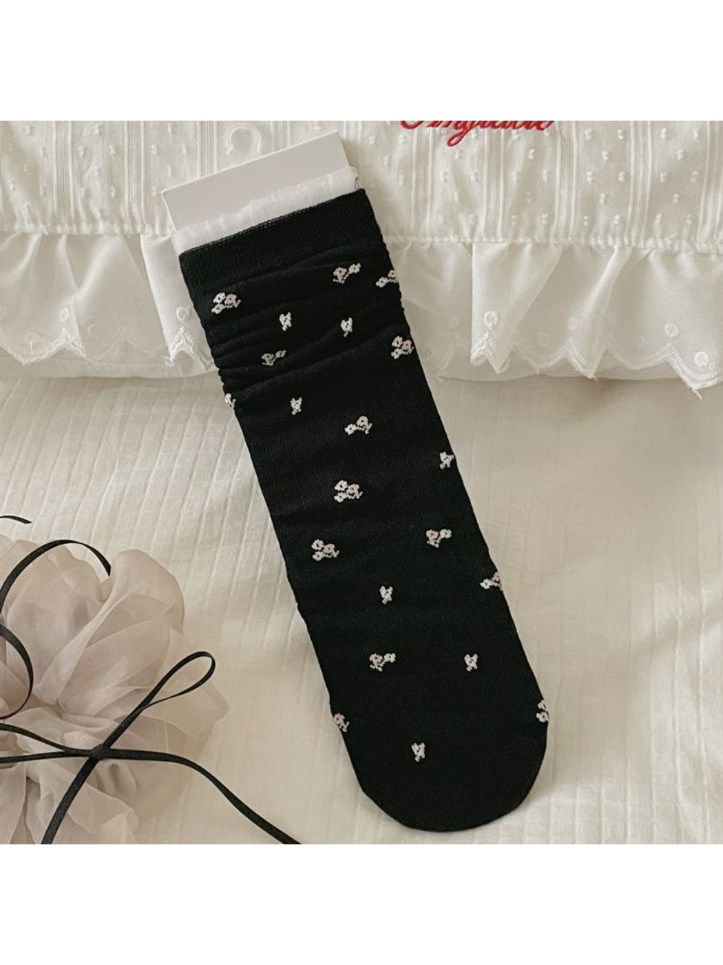Rufia socks folded to show ribbed cuff and bow print