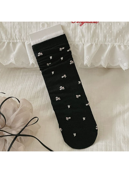 Rufia socks folded to show ribbed cuff and bow print